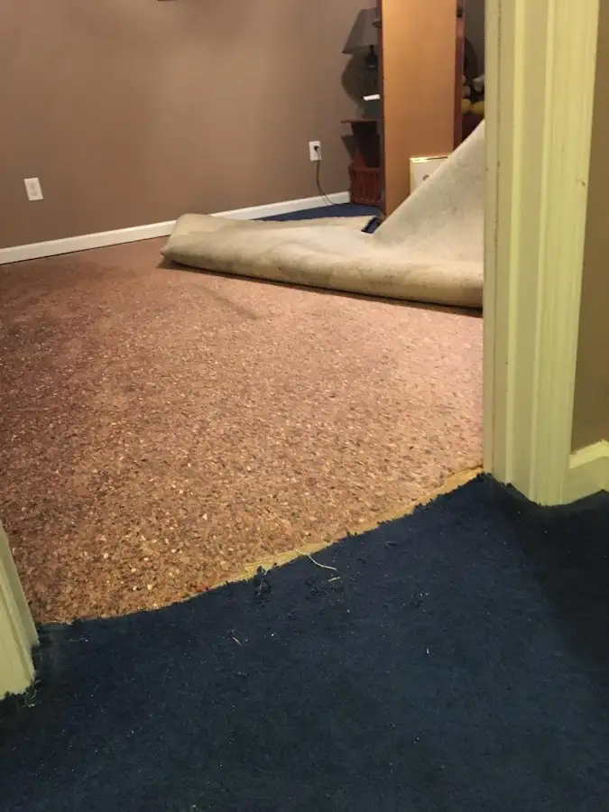 Carpet pad removal revealing water damage during Drying & Dehumidification in Compton
