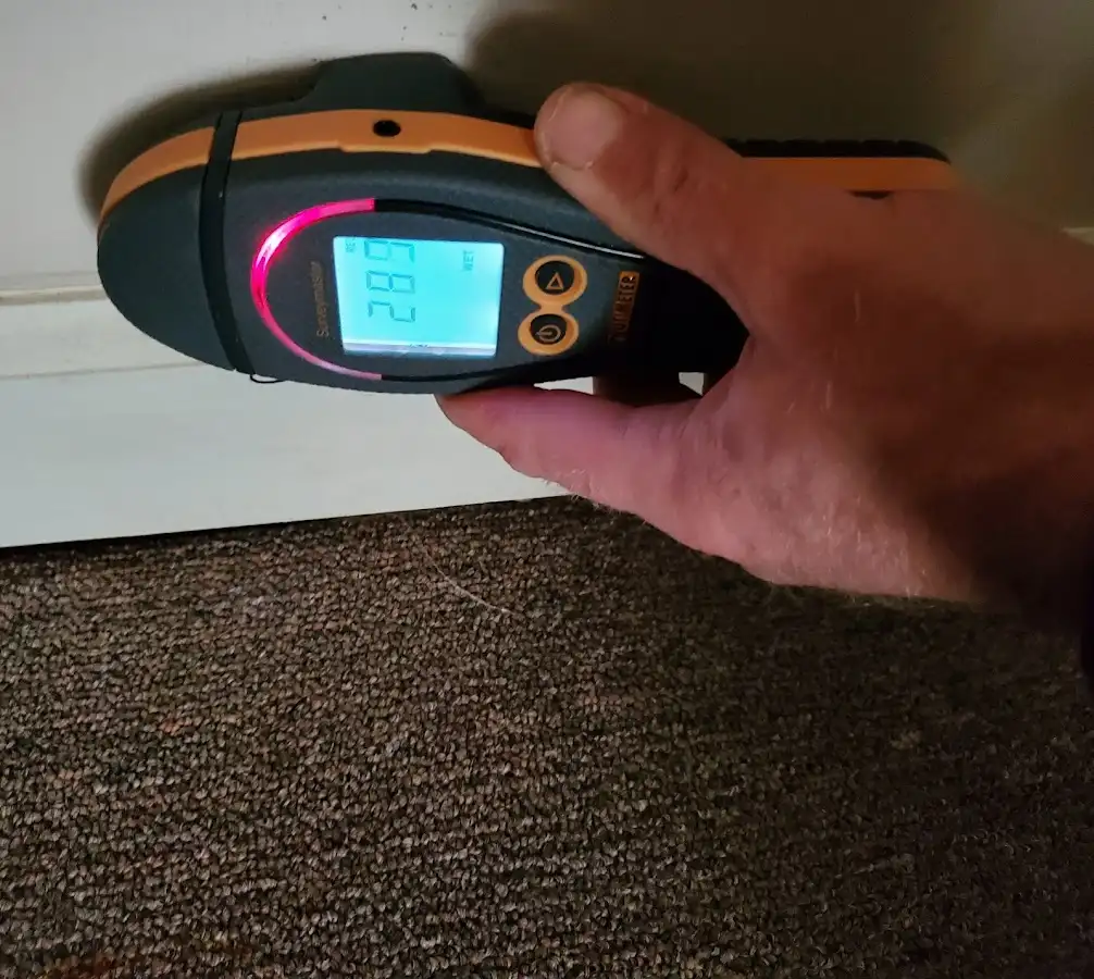 Moisture detection at baseboard during Sewage Cleanup & Sanitation in Compton
